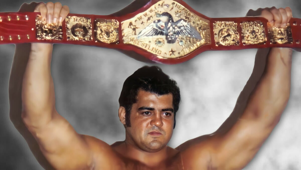 Pedro Morales hoists the WWWF Championship, embodying the raw passion of 1970s wrestling at Madison Square Garden.
