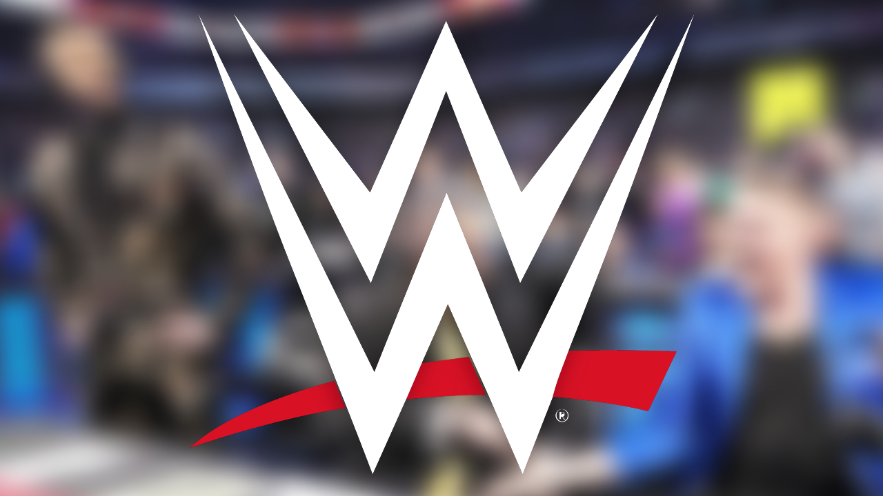 WWE logo over blurred Corey Graves Michael Cole Pat McAfee